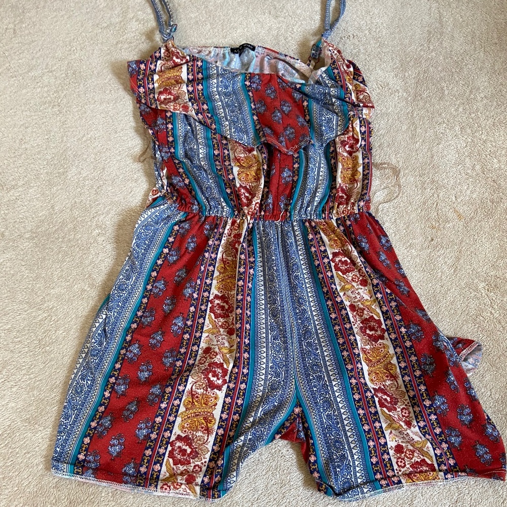 A colorful patterned romper